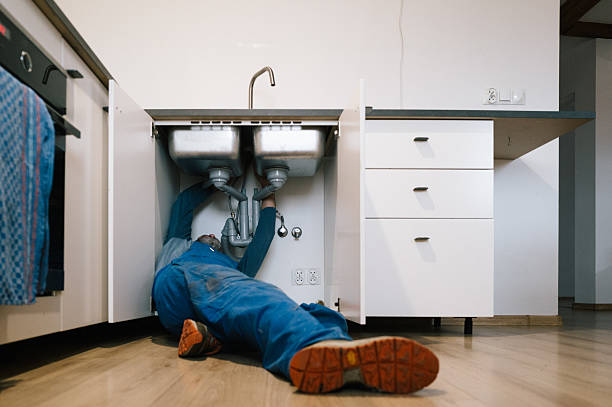 Professional Emergency Plumber technician working in Boxborough, MA